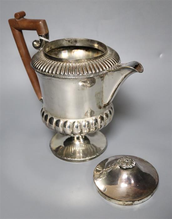 A silver milk jug and sugar bowl and a plated teapot and matching hot water jug,